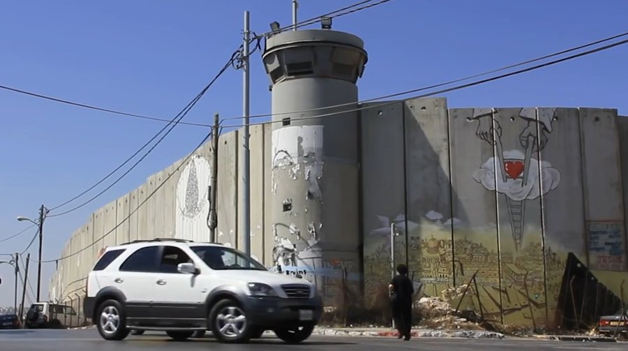 The separation wall and a watchtower in the West Bank, from Solidarity