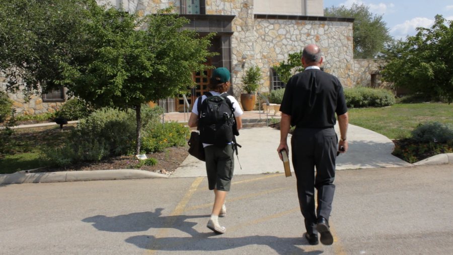 Walking with a priest on the set of The Kingdom Within